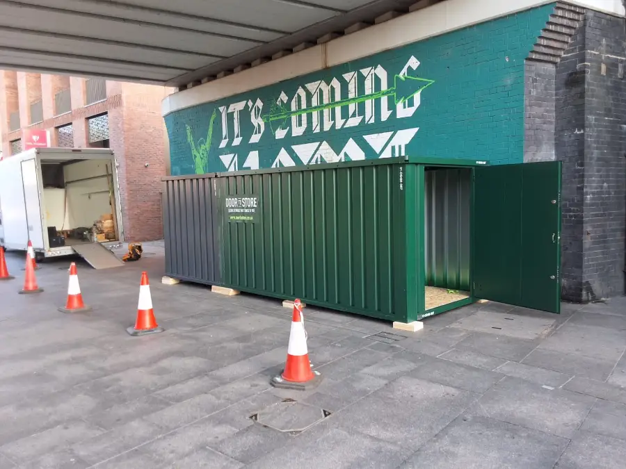 Door To Store unit being assembled outside a commercial building